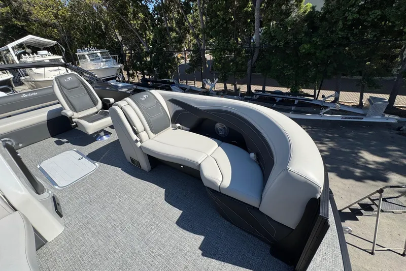 Slide: The Image of 2026 Barletta Cabrio 22UC boat interior with gray seating and carpeted flooring. - 33