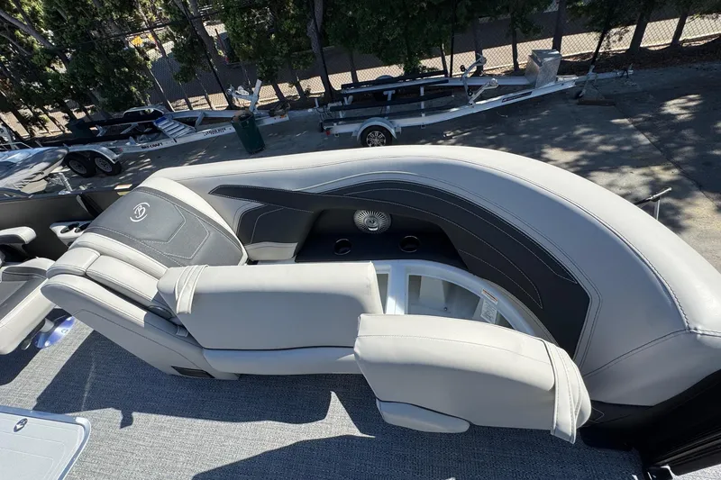 Slide: The Image of 2026 Barletta Cabrio 22UC boat interior with luxurious seating and cup holders. - 36