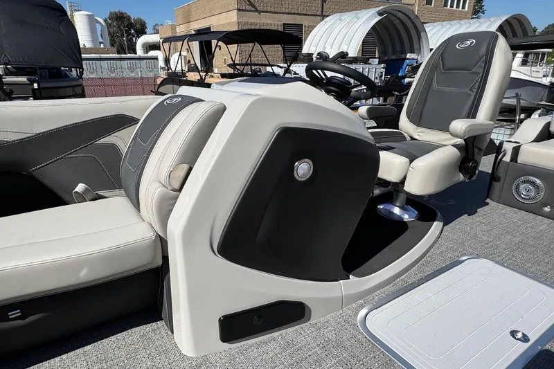 Slide: The Image of 2026 Barletta Cabrio 22UC boat interior with modern seating and steering console. - 41