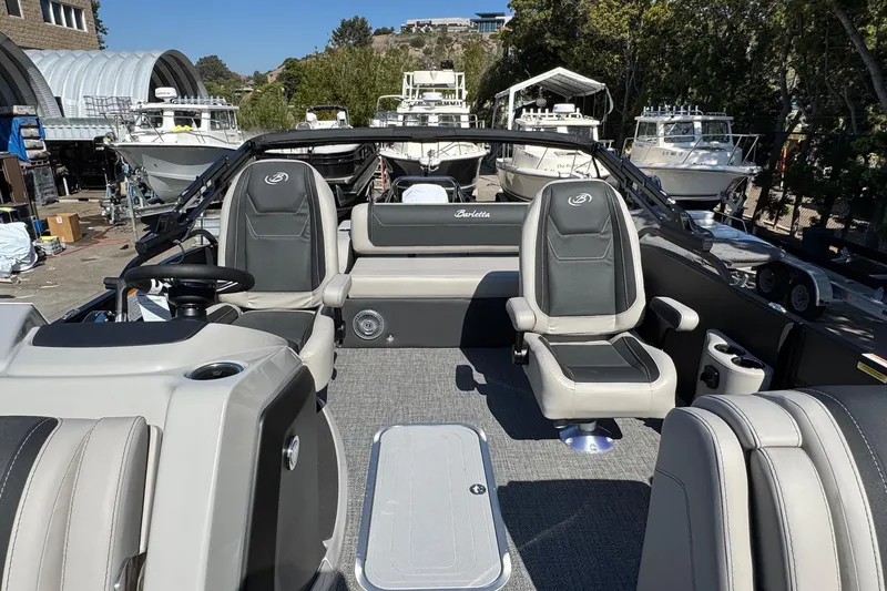 Slide: The Image of 2026 Barletta Cabrio 22UC pontoon boat interior with modern seating and steering wheel. - 43