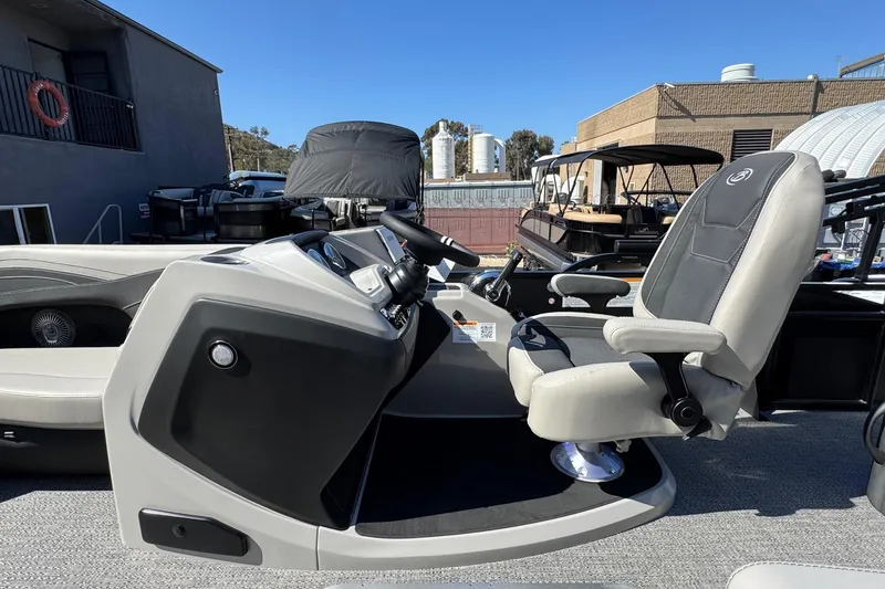 Slide: The Image of 2026 Barletta Cabrio 22UC boat interior with steering console and captain's chair. - 51