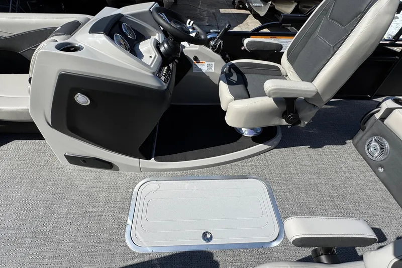 Slide: The Image of Captain's seat and console of 2026 Barletta Cabrio 22UC pontoon boat. - 52