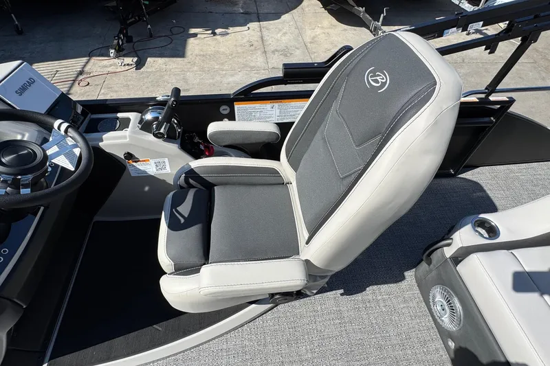 Slide: The Image of Captain's chair in 2026 Barletta Cabrio 22UC boat, featuring sleek design and modern controls. - 53