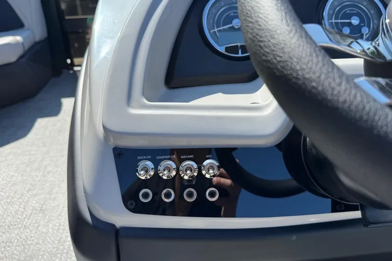 Slide: The Image of Control panel of 2026 Barletta Cabrio 22UC boat with switches and gauges. - 55