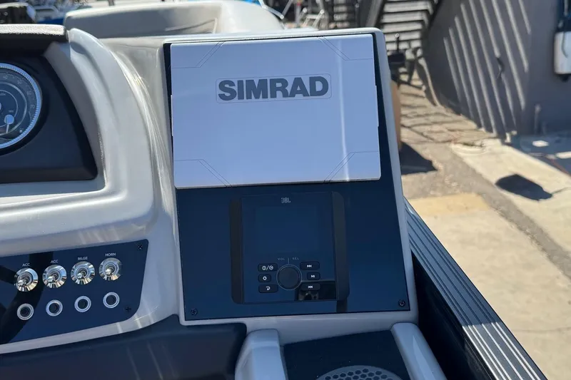 Slide: The Image of 2026 Barletta Cabrio 22UC dashboard featuring Simrad and JBL controls. - 58