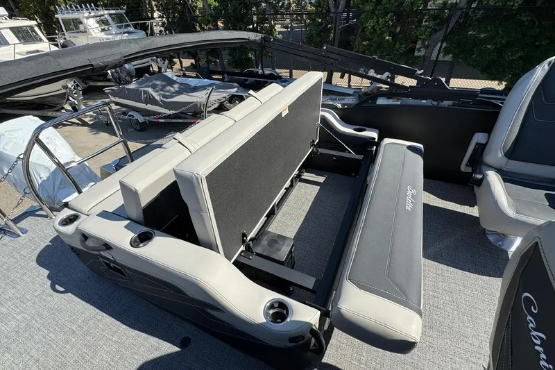 Slide: The Image of 2026 Barletta Cabrio 22UC boat interior with adjustable seating and cup holders. - 67
