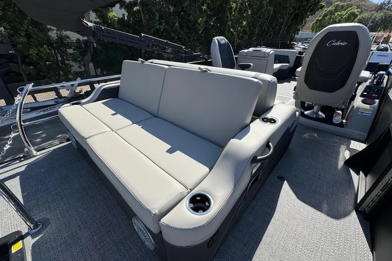 Slide: The Image of 2026 Barletta Cabrio 22UC boat interior with gray seating and cup holders. - 68