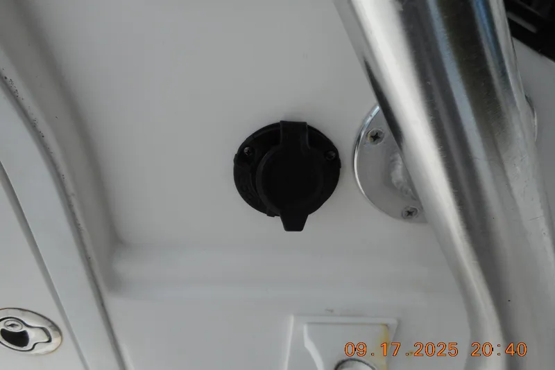 Slide: The Image of 2013 Sea Fox 246 Commander boat detail with metal railing and black fixture. - 20