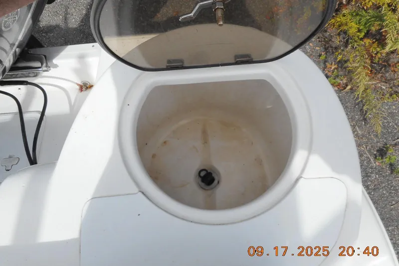 Slide: The Image of Open storage compartment on a 2013 Sea Fox 246 Commander boat, showing interior details. - 21