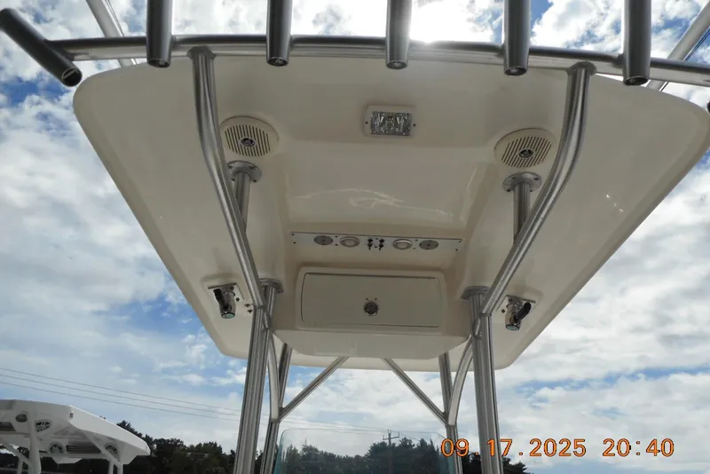Slide: The Image of T-top view of 2013 Sea Fox 246 Commander boat against cloudy sky. - 22