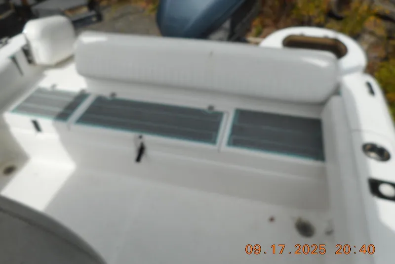 Slide: The Image of 2013 Sea Fox 246 Commander boat interior with seating and storage compartments. - 23