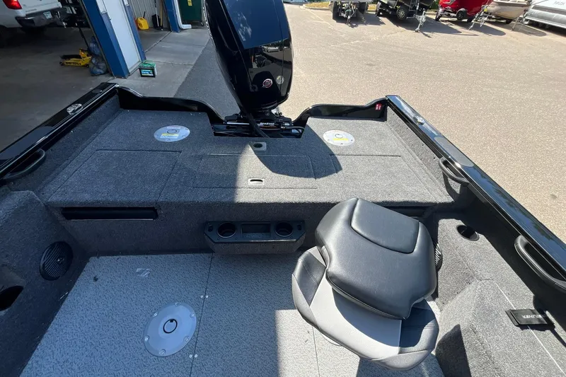 Slide: The Image of 2026 Crestliner 1850 Fish Hawk boat interior with seating and storage compartments. - 16