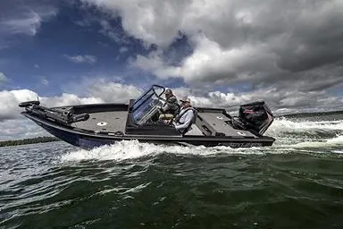 Slide: The Image of Manufacturer Provided Image: 2026 Crestliner 1850 Fish Hawk boat cruising on a lake under cloudy skies. - 18