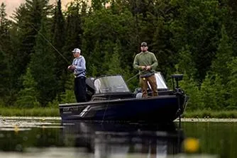 Slide: The Image of Manufacturer Provided Image: Two people fishing on a 2026 Crestliner 1850 Fish Hawk boat in a serene lake. - 21