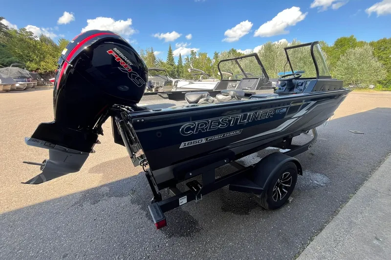 Slide: The Image of 2026 Crestliner 1850 Fish Hawk boat with Mercury Pro XS engine on a trailer. - 3