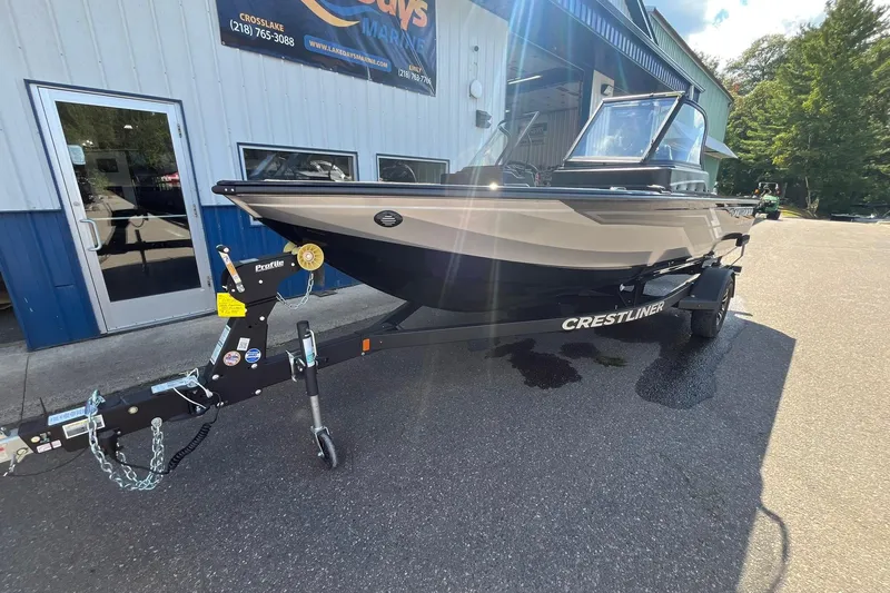 Slide: The Image of 2026 Crestliner 1850 Fish Hawk boat on trailer outside dealership. - 6