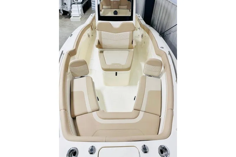 Slide: The Image of 2026 Scout 260 LXF boat interior with beige seating and modern design. - 11