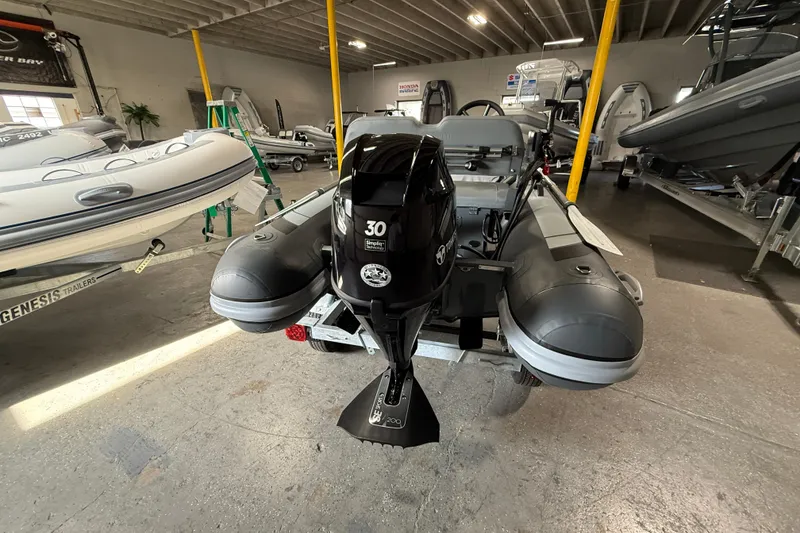 Slide: The Image of 2026 Highfield Classic 360 FCT boat with 30HP engine in showroom. - 12