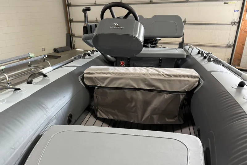 Slide: The Image of 2026 Highfield Classic 360 FCT inflatable boat interior with steering console and seating. - 14