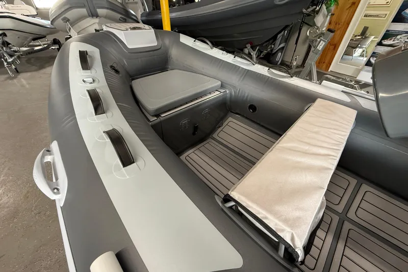 Slide: The Image of 2026 Highfield Classic 360 FCT inflatable boat interior with seating and storage. - 17
