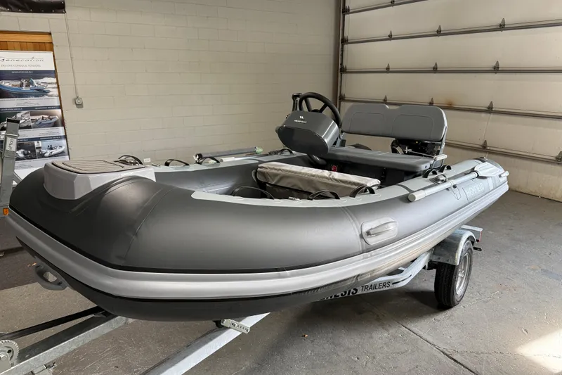 Slide: The Image of 2026 Highfield Classic 360 FCT inflatable boat on trailer in garage. - 3
