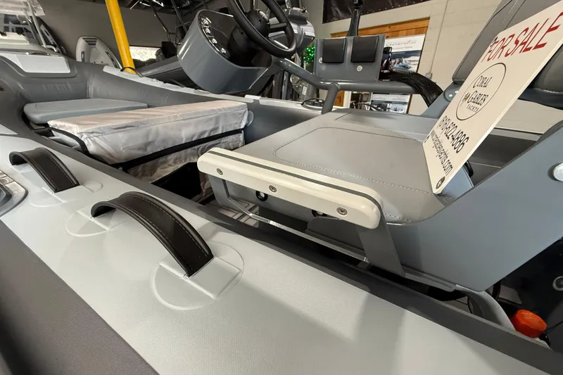 Slide: The Image of 2026 Highfield Classic 360 FCT boat interior with seating and "For Sale" sign. - 7