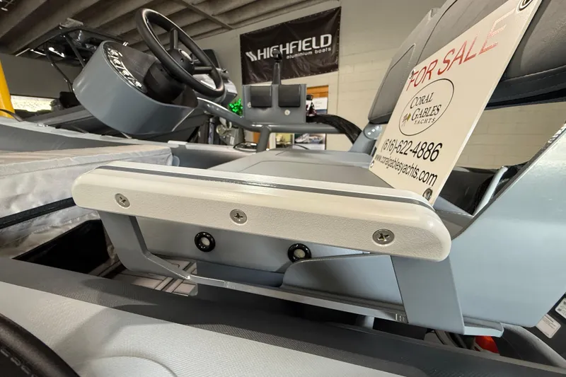 Slide: The Image of 2026 Highfield Classic 360 FCT boat interior with steering wheel, for sale sign visible. - 9