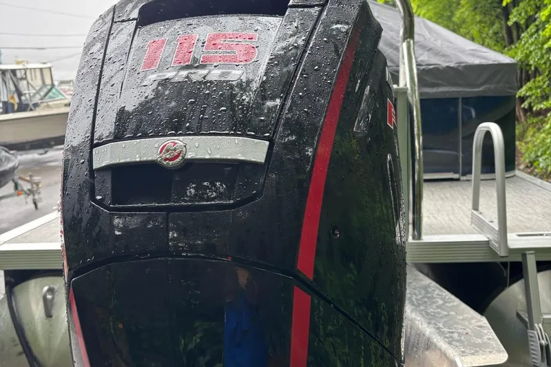 Slide: The Image of Wet outboard motor on Avalon Venture Cruise Rear Bench 2025 boat, featuring "115 Pro" branding. - 3