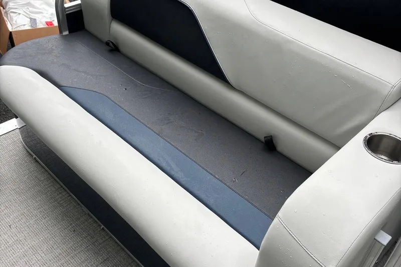 Slide: The Image of 2025 Avalon Venture Cruise Rear Bench with cup holder, featuring sleek gray and blue upholstery. - 5