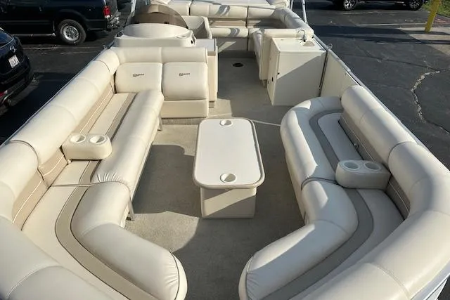 Slide: The Image of 2001 Crest Grand Caribbean pontoon boat with spacious seating and central table. - 20