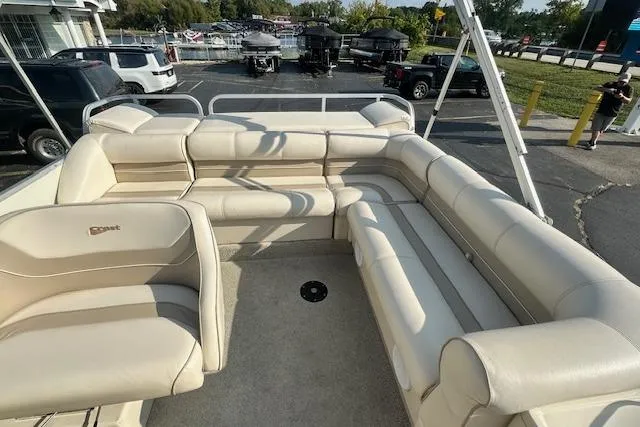 Slide: The Image of 2001 Crest Grand Caribbean boat with spacious beige seating and outdoor view. - 24