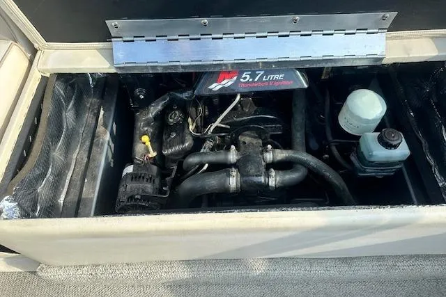 Slide: The Image of Engine compartment of a 2001 Crest Grand Caribbean boat with 5.7-liter engine. - 26