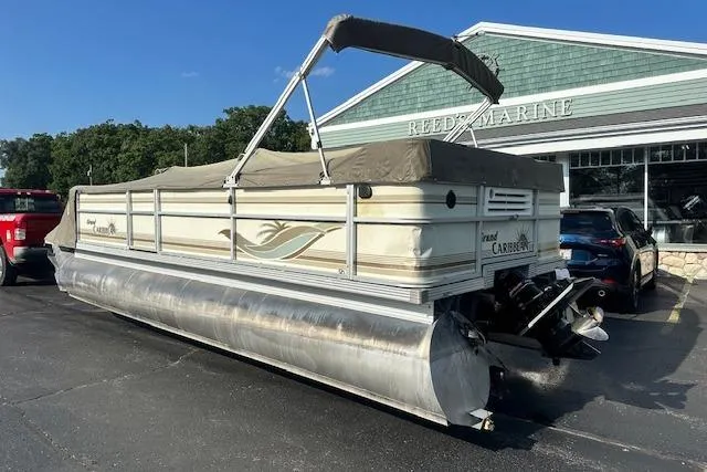Slide: The Image of 2001 Crest Grand Caribbean pontoon boat parked at Reed's Marine dealership. - 28
