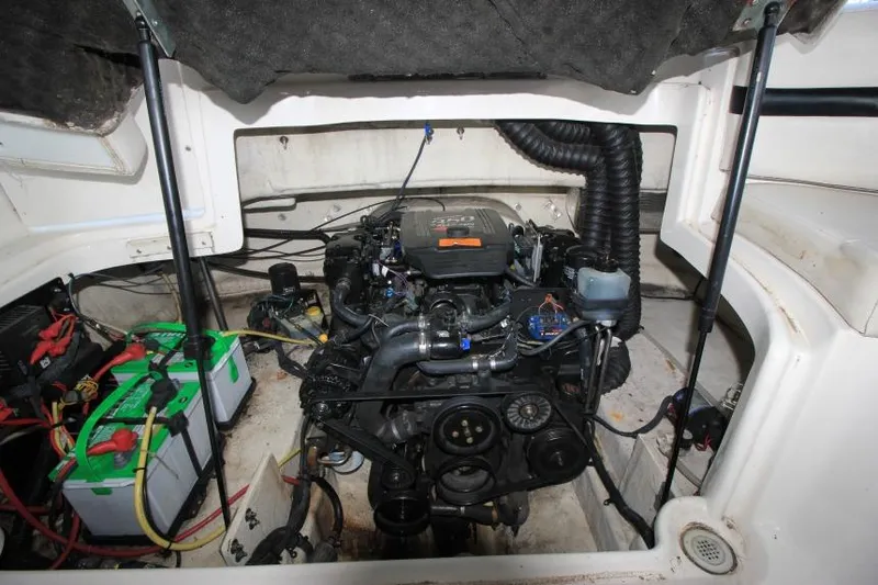 Slide: The Image of Engine compartment of a 2002 Chaparral 220 SSi boat, showing detailed components and wiring. - 17