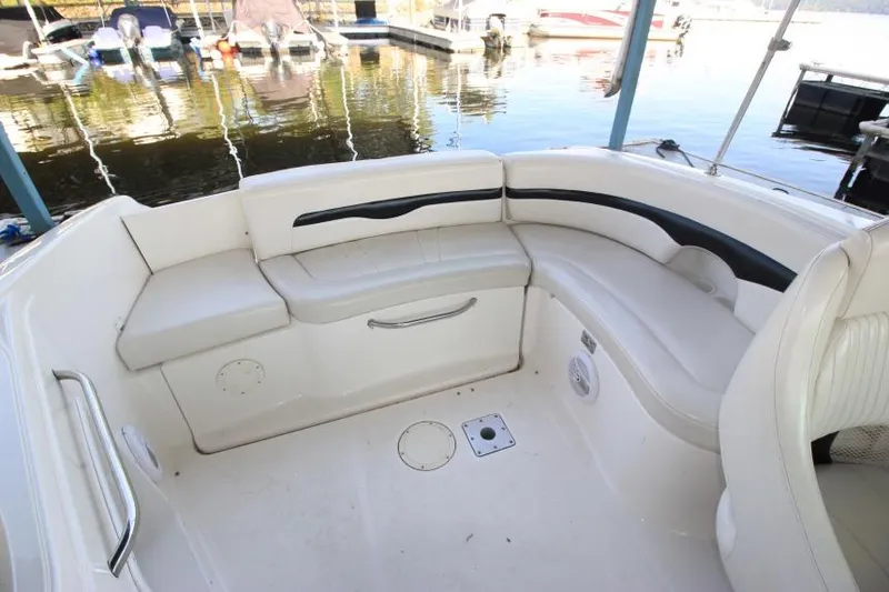 Slide: The Image of 2002 Chaparral 220 SSi boat interior with white seating and water view. - 6