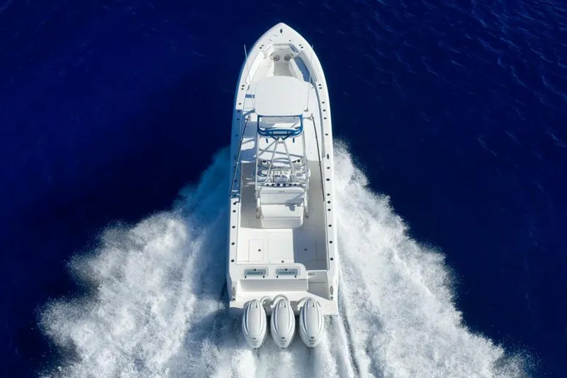Slide: The Image of 2023 Contender 39 ST boat cruising on deep blue ocean waters. - 11