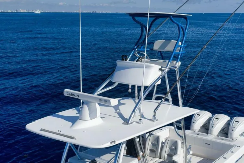 Slide: The Image of 2023 Contender 39 ST boat with tower and Garmin radar on open ocean. - 15