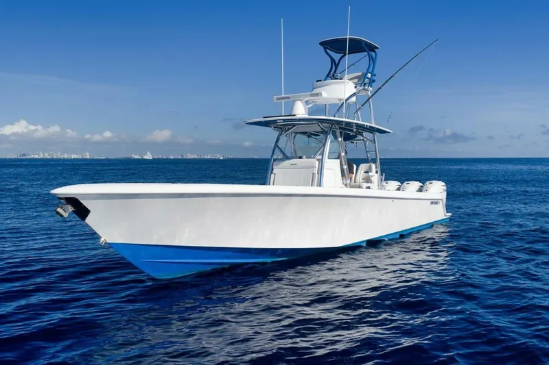 Slide: The Image of 2023 Contender 39 ST boat on open ocean under clear blue sky. - 4