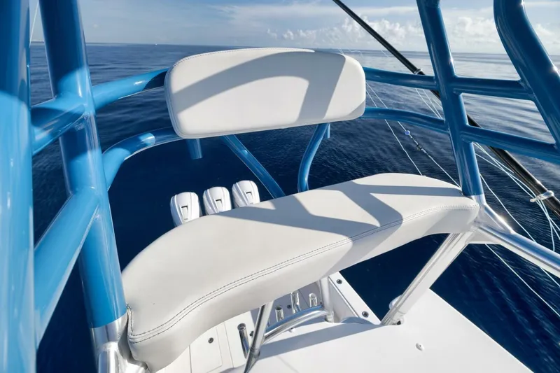Slide: The Image of 2023 Contender 39 ST boat seat with blue frame on calm ocean. - 41