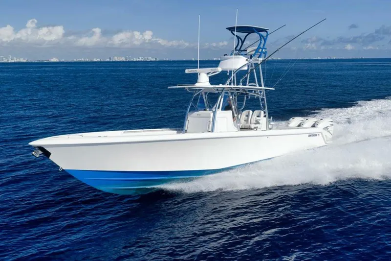 Slide: The Image of 2023 Contender 39 ST boat cruising on open blue ocean waters. - 8