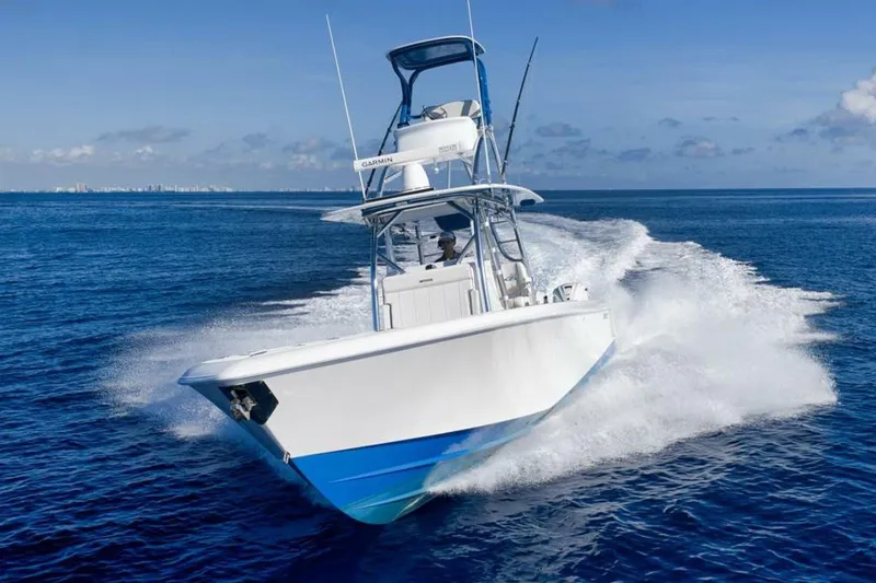 Slide: The Image of 2023 Contender 39 ST boat cruising on open ocean waters. - 9