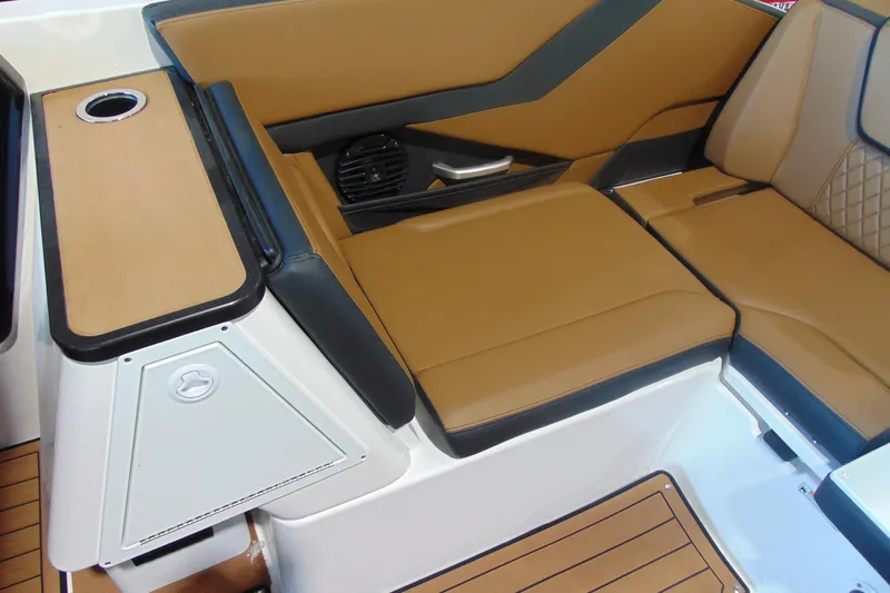 Slide: The Image of 2026 Yamaha Boats 252SD interior with tan seating and modern design. - 11
