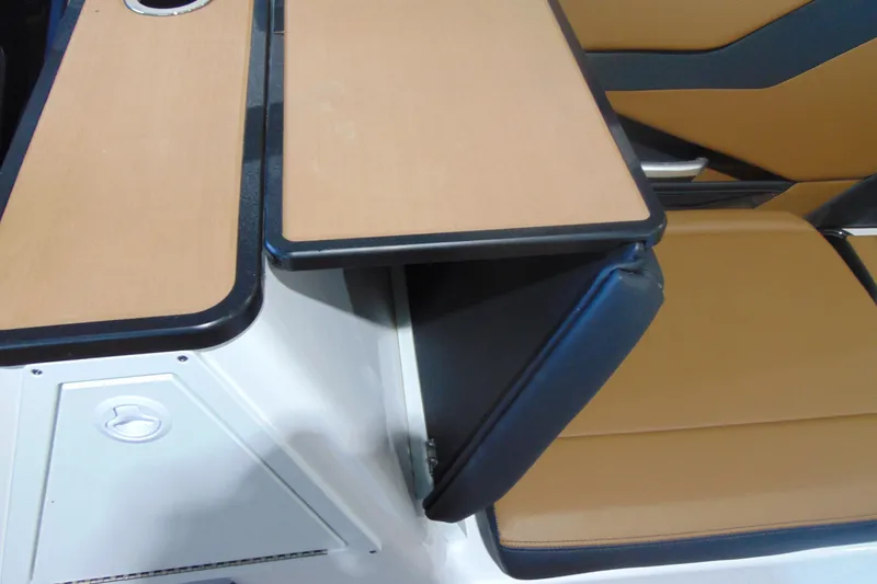 Slide: The Image of 2026 Yamaha Boats 252SD interior with tan seating and sleek table design. - 12