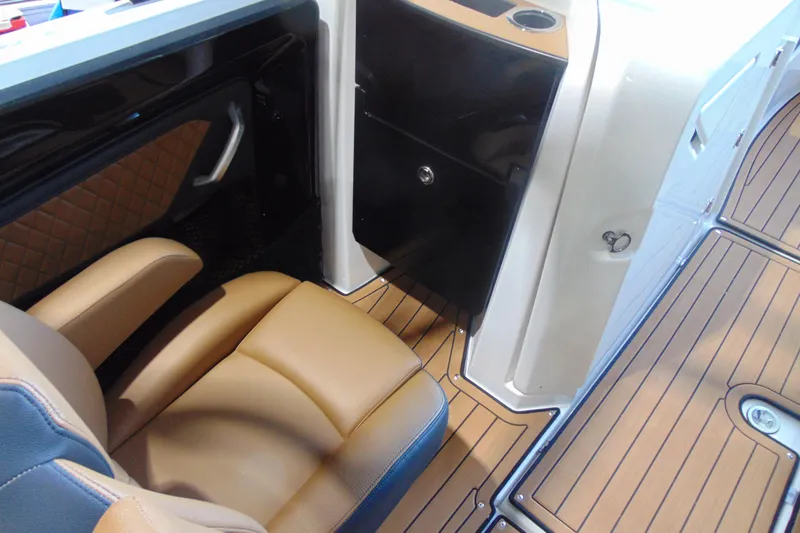 Slide: The Image of 2026 Yamaha Boats 252SD interior with tan seating and sleek black cabinetry. - 14