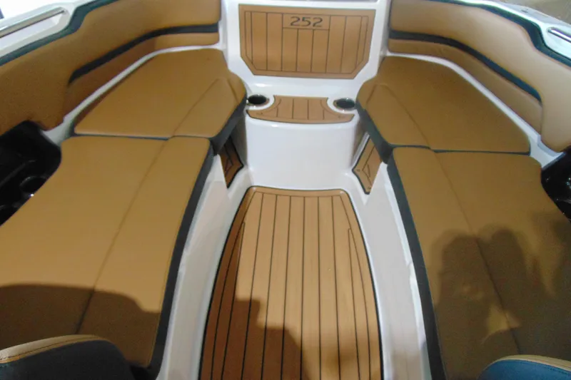 Slide: The Image of 2026 Yamaha Boats 252SD interior with tan seating and wood-style flooring. - 20