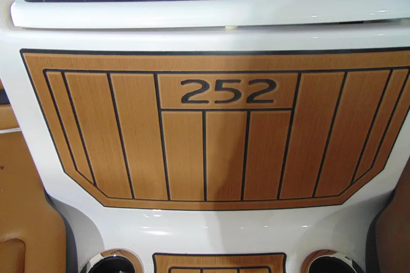 Slide: The Image of 2026 Yamaha Boats 252SD dashboard with wood panel design. - 21