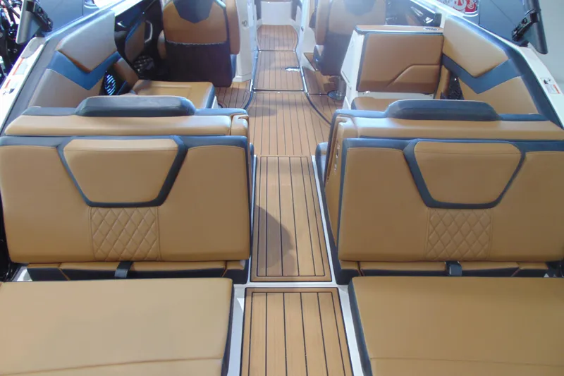 Slide: The Image of Luxurious interior of 2026 Yamaha Boats 252SD with tan leather seating and sleek design. - 7