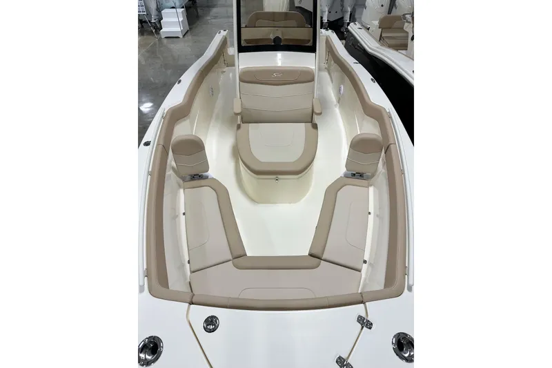 Slide: The Image of 2026 Scout 240 XSF boat interior with beige seating and sleek design. - 10