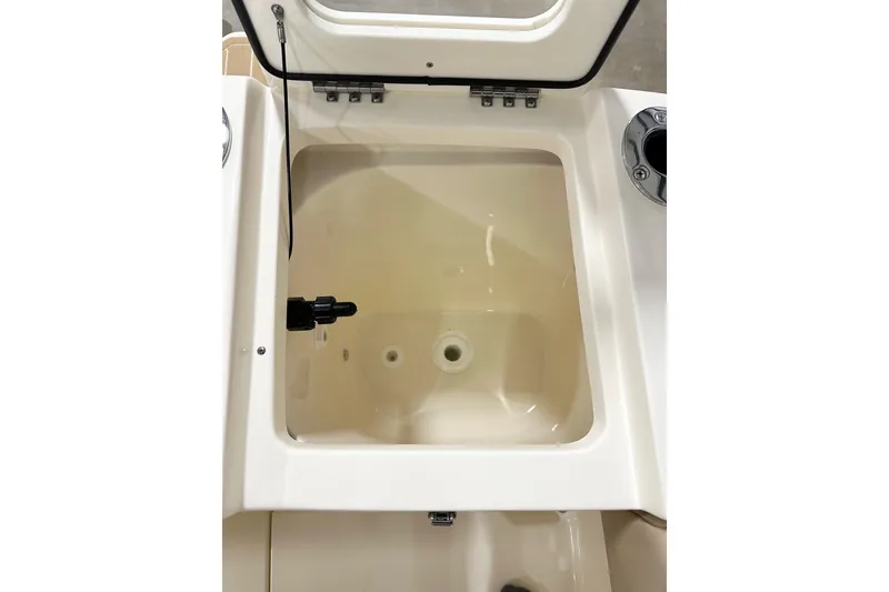 Slide: The Image of 2026 Scout 240 XSF boat compartment with open lid, showcasing interior details. - 14