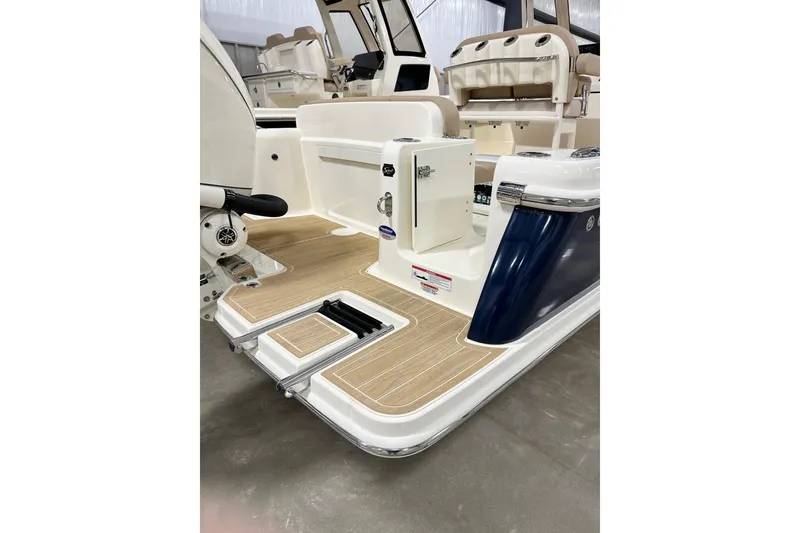 Slide: The Image of 2026 Scout 240 XSF boat interior with teak flooring and modern design features. - 15